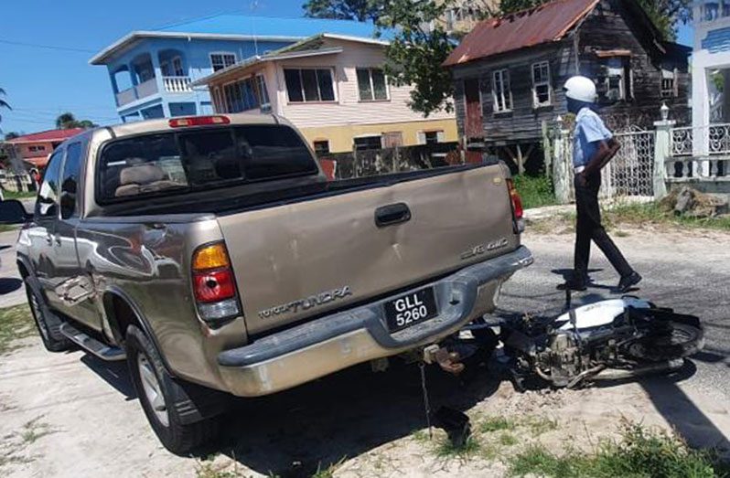 The motorcycle and Toyota Tundra pickup at the scene of the accident