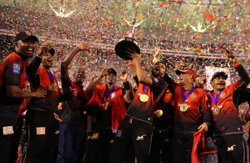 Ali Khan of Trinbago Knight Riders celebrates teammates as he lifts the winners trophy during the Hero Caribbean Premier League Final between Trinbago Knight Riders and Guyana Amazon Warriors at Brian Lara Stadium on September 16, 2018 in Tarouba, Trinidad and Tobago. (Photo by Ashley Allen - CPL T20/Getty Images)