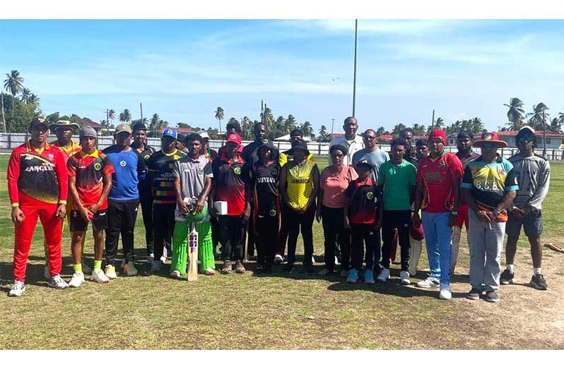 The young Berbician cricketers with Roger Harper and BCB coach Winston Smith