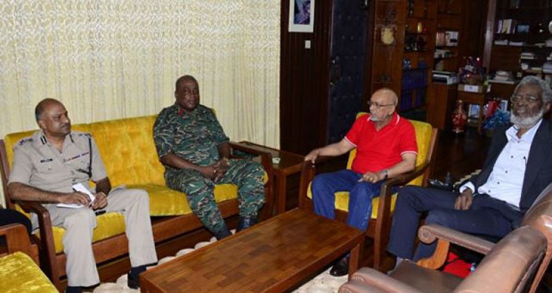 President Donald Ramotar (second right) in meeting with, from left, Commissioner  of Police (Ag), Mr Seelall Persaud; Chief-of-Staff of the Guyana Defence Force, Brigadier Mark Phillips; and Secretary to the Defence Board, Dr  Roger Luncheon