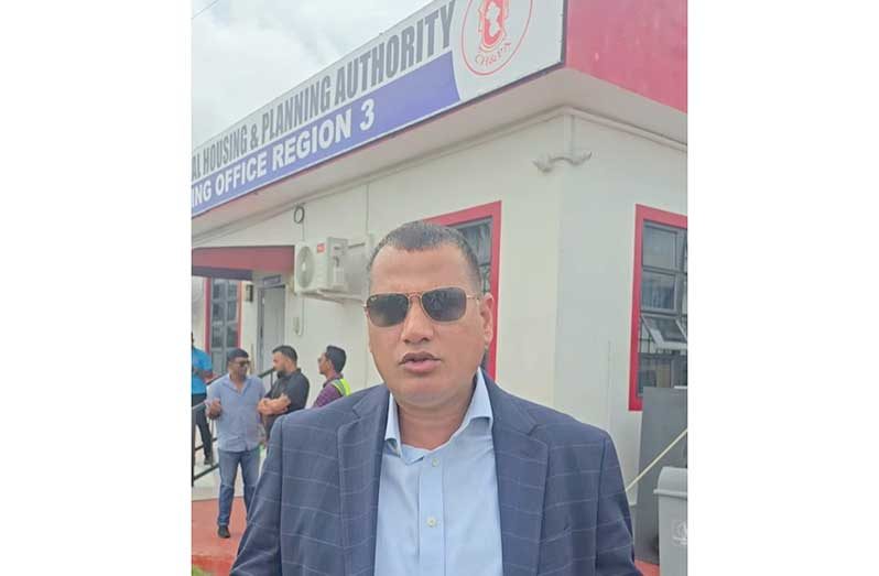 Minister of Housing, Collin Croal, during a visit to the Region Three Housing Office