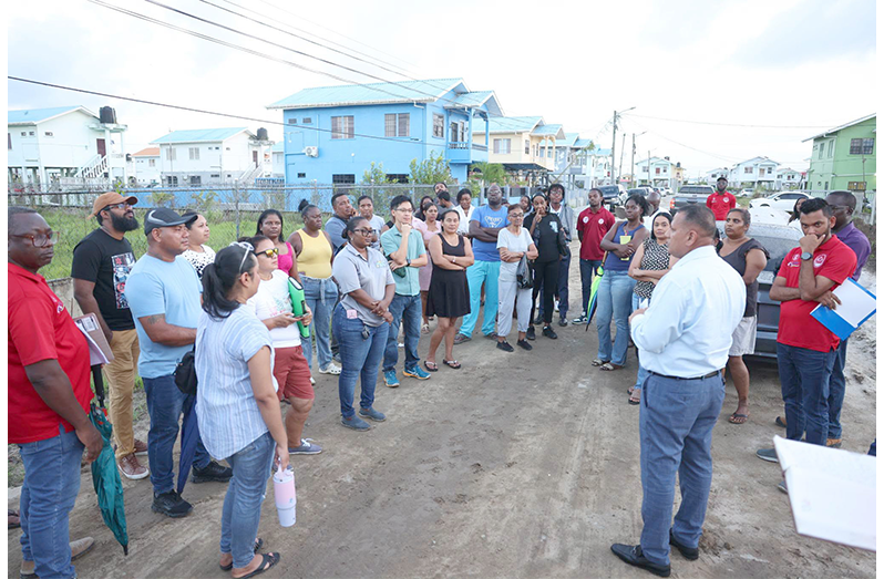 Housing Minister, Collin Croal, during a community engagement with residents of Cummings Lodge Housing Scheme addressing concerns raised by homeowners