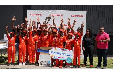 The victorious Cropper Primary, along with officials from ExxonMobil Guyana and FL Sport
