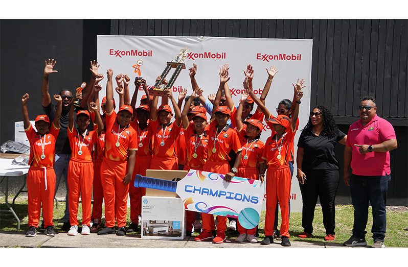 The victorious Cropper Primary, along with officials from ExxonMobil Guyana and FL Sport