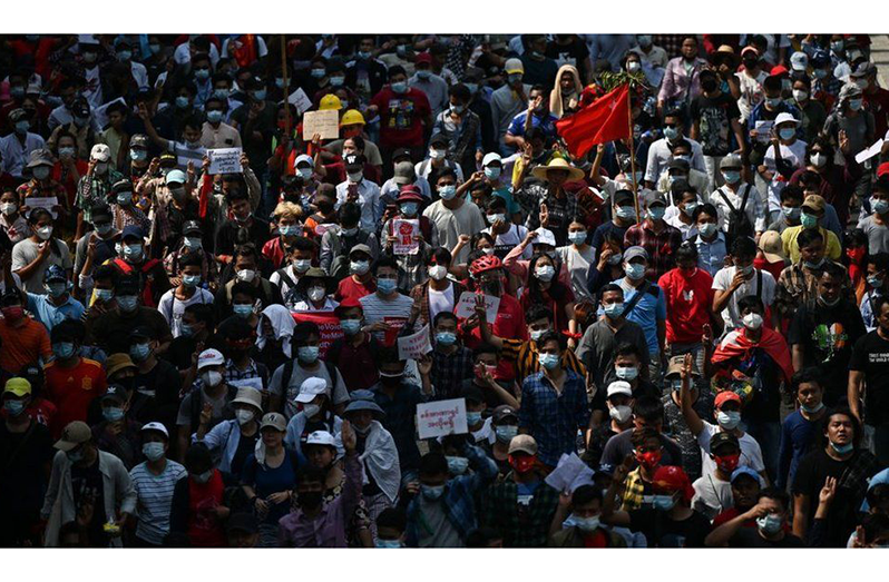 Anti-coup protesters gathered in Yangon on Sunday despite an internet shutdown (BBC photo)