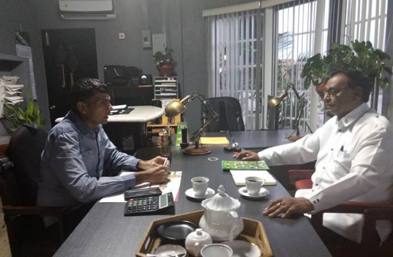 Ambassador Halim Majeed in discussion with Feyaad Hack (left) at the Cane Grove Rice Mill