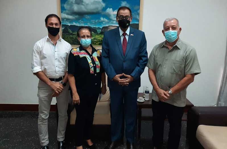 President of ALIMPORT, Alejandro Mustelier, (first from right) with Guyana’s Ambassador to Cuba, Halim Majeed, (second from right) and two other officials of ALIMPORT