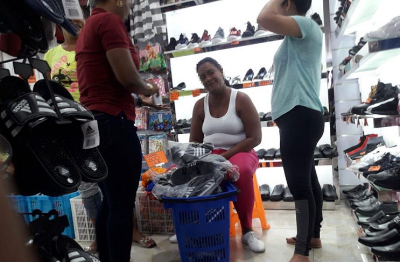 Cubans buying zapatos (shoes) inside ‘Lucky star’