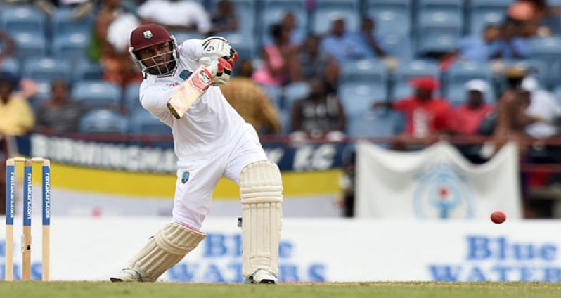 West Indies middle-order batsman Marlon Samuels cuts loose late in the day to finish unbeaten on 94. (Photo courtesy of AFP)