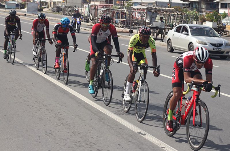 Cyclists battling in the second stage at Lusignan on the East Coast of Demerara.