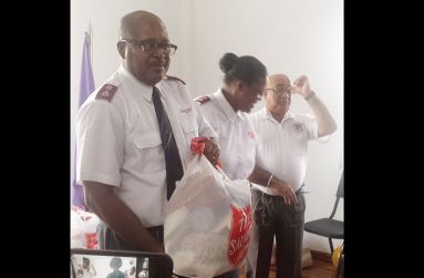 D.C. Major Saint Lot and DDWM Mireille Saint Lot kick off the distribution process to the flood-hit victims of Stewartville.  With them is REO Denis Jaikaran.
