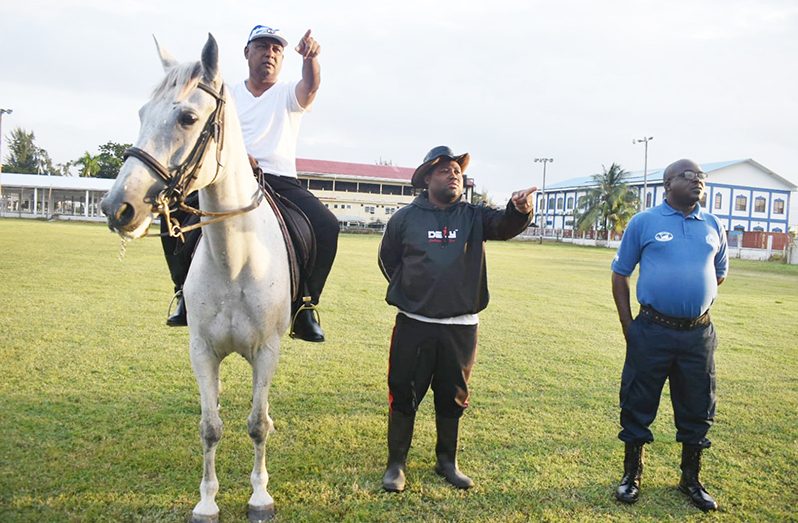 (On horse) Deputy Commissioner of ‘Operations’, Ravindradat Budhram, with officer-in-charge of the Mounted and Canine Section, Deputy Superintendent Rockwell Delph, with another rank at the Police Sports Club Ground, during Wednesday’s meeting
