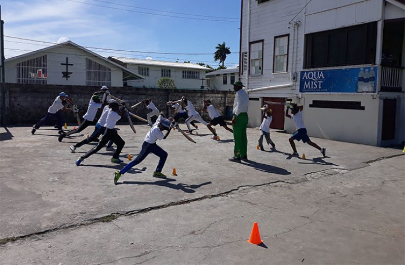 Former West Indies player Roger Harper take some participants through their paces at last year’s camp.