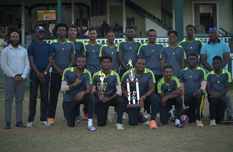 DCC takes a photo-op with the trophy following their win yesterday (Yohan Savory photo)