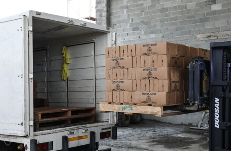 Cases of Topco juice being loaded for distribution