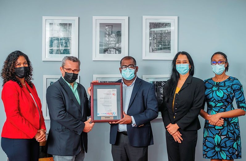 From left to right: Deputy Branch Manager, SGS Guyana – Davie Sukdeo; Regional Managing-Director, SGS Central America and the Caribbean Region – Cedric Catheline; Managing-Director, DDL – Ramesh Persaud; Director – Technical Services, DDL – Sharon Sue-Hang Baksh; Snr Quality Assurance Chemist, DDL – Keisha Hercules-Fraser