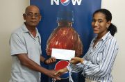 RHTY&SC cricket manager Robby Kissoonlall receives the sponsorship from Sherese Leander, Marketing representative of DDL.