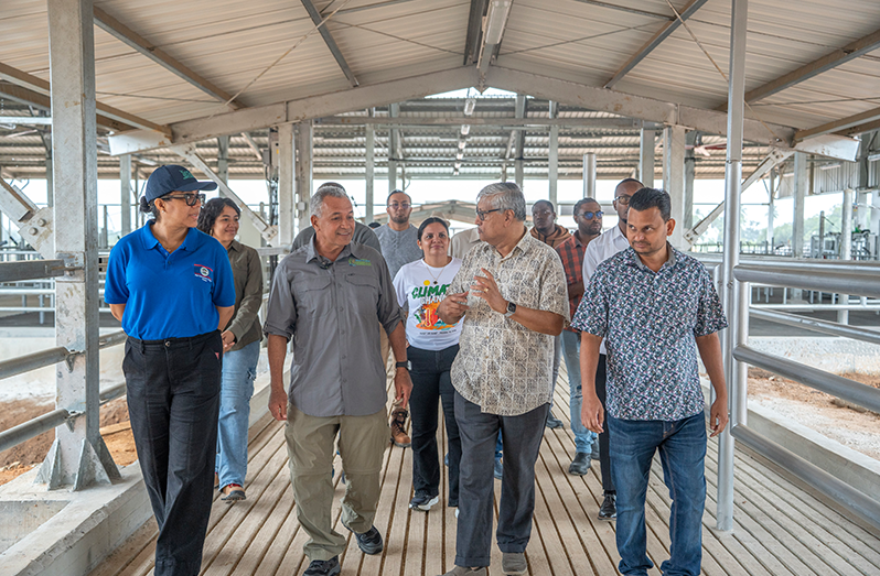 Minister Hamet on tour with DDL Chairman, Komal Samaroo, at the Dairy Project