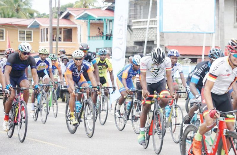 Team Evolution’s Paul DeNobrega (forefront) made a welcome return to the top of the podium at the GBI/Oasis Water 70-mile road race in Berbice.
