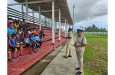Regional Commander No. 6, Assistant Commissioner of Police Shivpersaud Bacchus watches on as Deputy Superintendent Newland makes a point during the interaction with the students