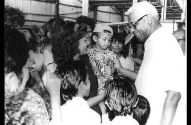 President Desmond Hoyte chats with some of the residents who turned up for a rice festival at Ruimzeight, West Coast Demerara. (December 19, 1991)