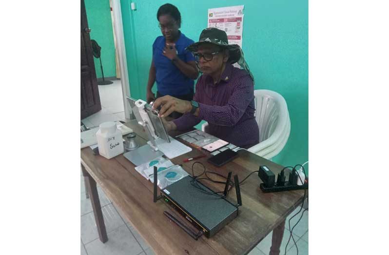 Director General of the Ministry of Health, Dr. Vishwa Mahadeo, assesses the Telemedicine Service in Siparuta