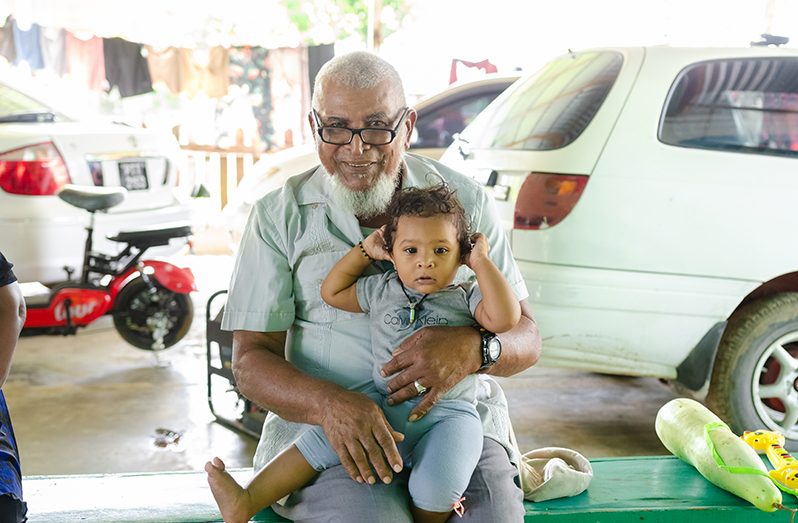 Moulvi Sheer Mohamed with his great-granddaughter, Saudia (Delano Williams photos)