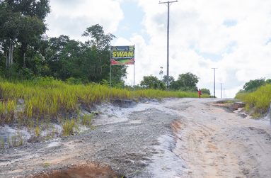 The signage of the name of the village on the main access road to Swan (Delano Williams)