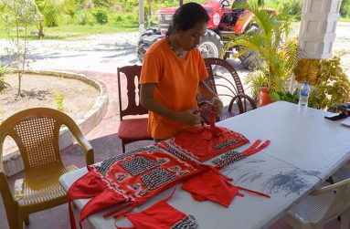 Sarah Fredericks putting together an outfit for heritage celebrations in the village