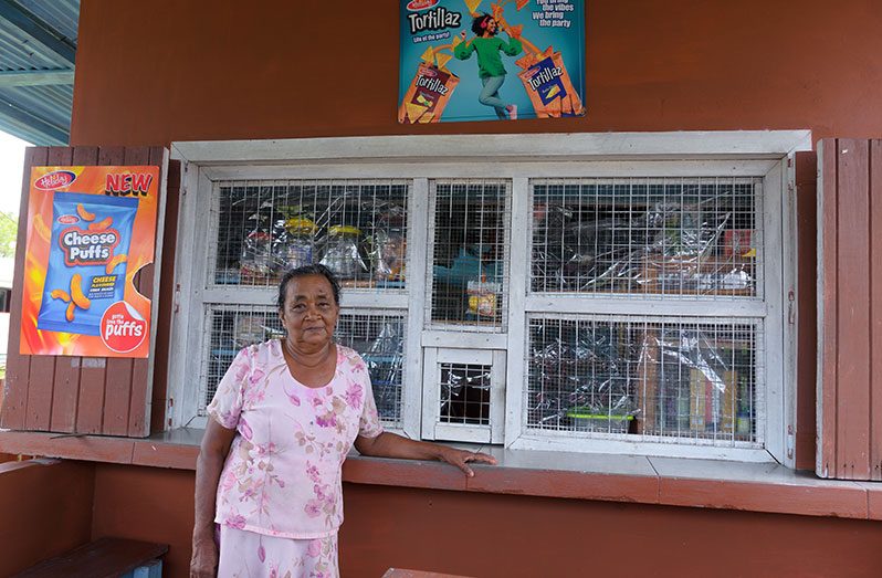 Deomattie Ball poses by her shop (Delano Williams photos)