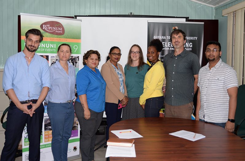 Swisscontact Veronica Schanderl (fifth from left) poses with GTA staffers following the press conference on Friday at the GTA boardroom.