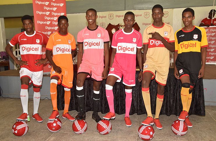 Players display the new uniforms that will be worn in this year’s Digicel Schools Football Championship (Adrian Narine Photo)