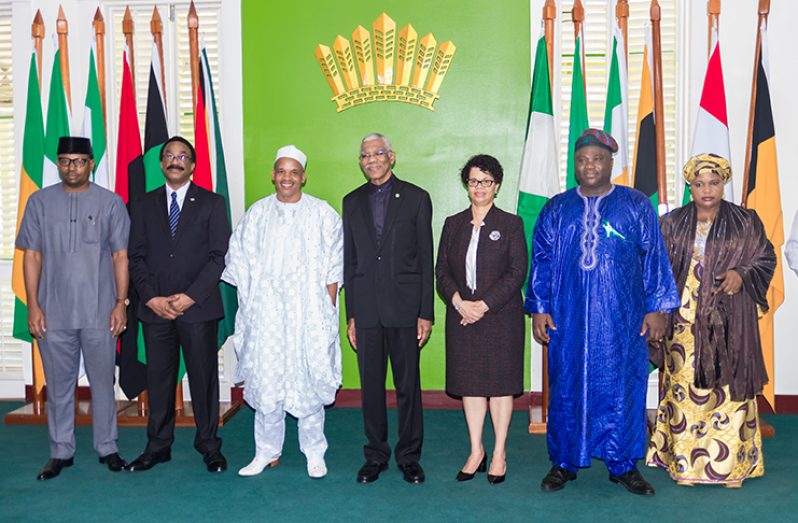 High Commissioner of the United Republic of Tanzania, Emmanuel John Nchimbi, shares a photo with the President (Delano Williams photo)