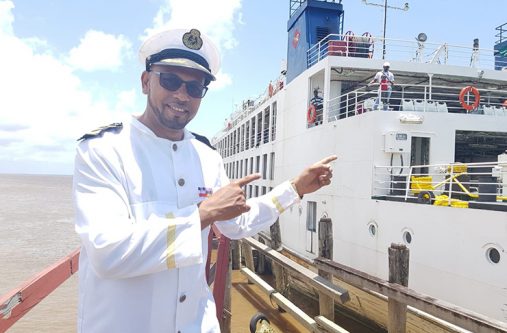 Paul Adrian Bonar Jnr. aka DJ Stress posing next to one of the Chinese ferries that will be used for the boat cruise.