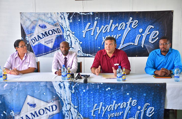 President of the GHB, Philip Fernandes, makes a point during yesterday’s launching of the 13th Diamond Mineral Water Indoor Hockey Festival. To his left is Devin Hooper, DDL Brand Executive Larry Wills, and Tiffany Solomon. (Samuel Maughn photo)