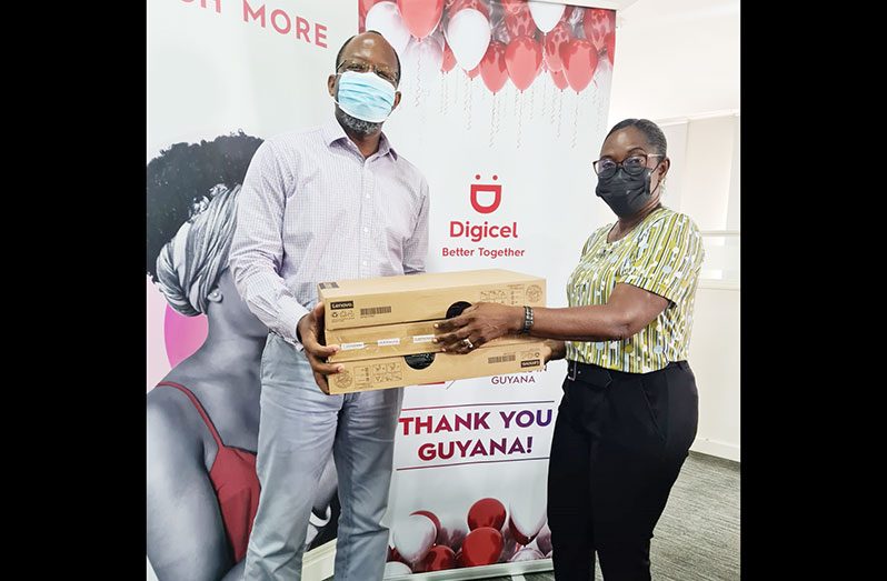 Digicel Guyana Chief Executive Officer, Gregory Dean, donates the systems to Women Across Differences Coordinator, Clonel Samuels-Boston