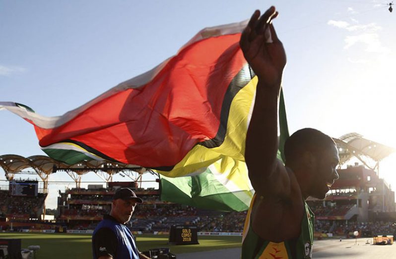 Troy Doris celebrates with the Golden Arrowhead after winning gold in the Men’s triple jump at the 2018 Commonwealth Games.