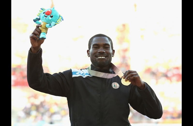 Guyana’s Troy Doris shows off his Commonwealth Gold, the medal he won in the men’s triple jump in Australia.