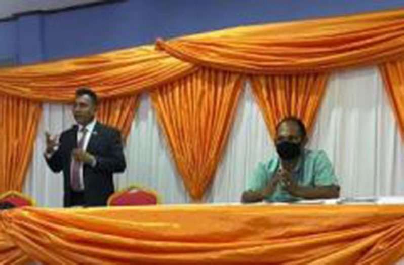 CEO of the Guyana Office for Investment, Dr. Peter Ramsaroop, speaking at a town hall meeting in Region Six on Wednesday