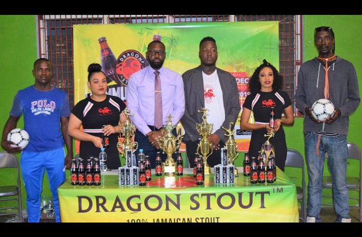 Director of Sport Christopher Jones (third left) and Dragon Stout Brand Coordinator, Jamal Baird, (third right) with Dragon Stout models and team representatives (Avenash Ramzan photo).