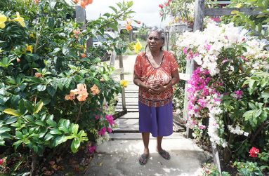 Singh among her flowers in her yard