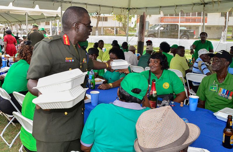 Guyana Defence Force Chief-of-Staff, Brigadier George Lewis serves the veterans on their special day