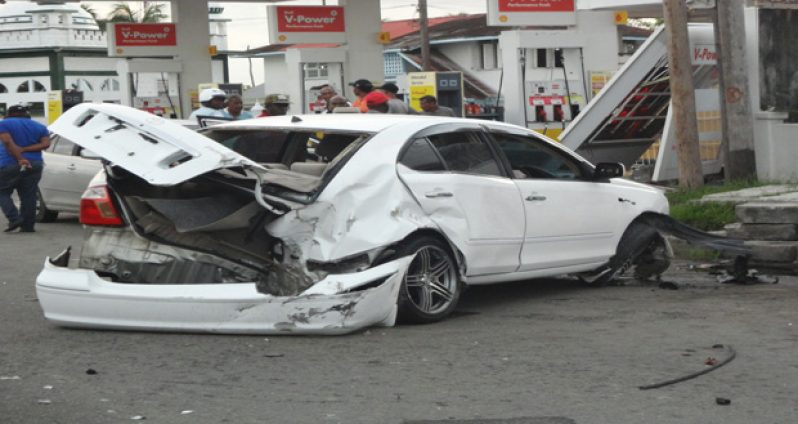 The Toyota Allion which was quickly abandoned by its young driver and other occupants after a high speed crash near the Shell gas station on the McDoom Public Road yesterday