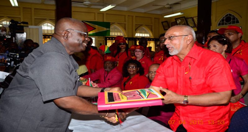 ‘LISTS IN’: President Donald Ramotar presenting the PPP/C lists to Chief Elections Officer Mr. Keith Lowenfield yesterday (Adrian Narine photo)