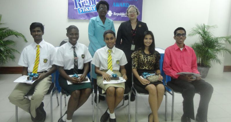 General Manager (Credit) Patricia Plummer and General Manager (Corporate and Management Services) Denise Hobbs, pose with the RightStart awardees from left: Cecil Cox, Jubilante Cutting, Akeisha Wiltshire, Reshma Ramdahin and Akash Jairam at the Republic Bank RightStart CSEC Awards ceremony.