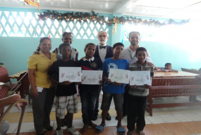 Mexican Ambassador to Guyana, Senor Francisco Olguin, and other representatives from the Embassy of Mexico, poses with some of the participants of the “This is my Mexico” drawing competition