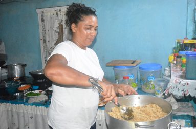 Nadira Gildharry in her kitchen cooking various dishes