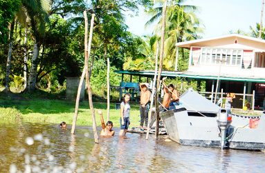 Residents having a cool bath in the Bonasika Creek (Carl Croker photos)