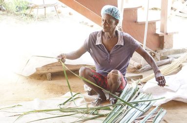Yulisse Klass in the pointer broom-making process at her home