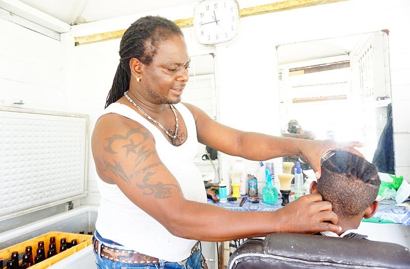 Barber Dylon Granville at his job